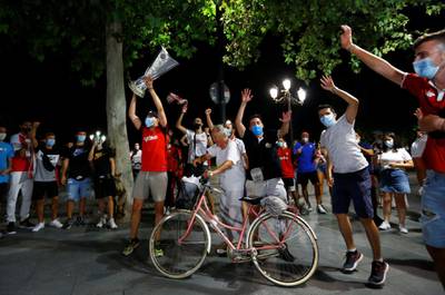 Sevilla fans celebrate in Seville. Reuters