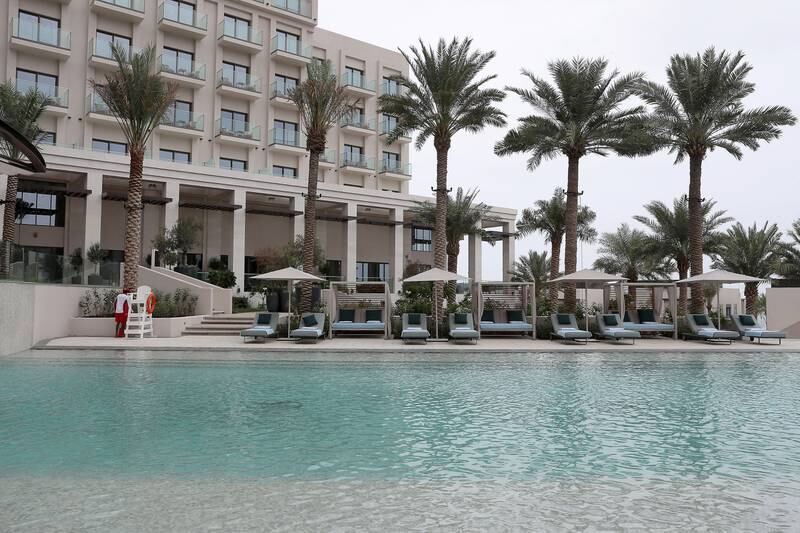 A palm tree-lined pool