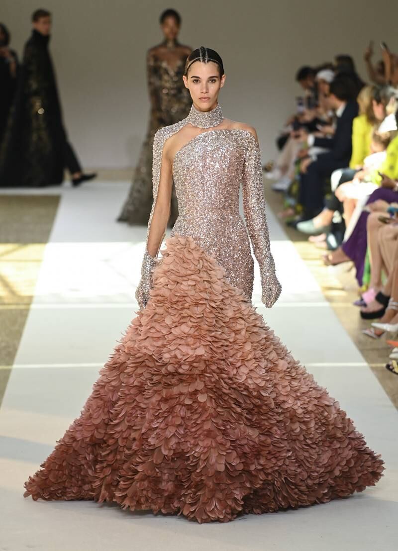 Elie Saab also shows his womenswear collection, including this asymmetric gown. Getty