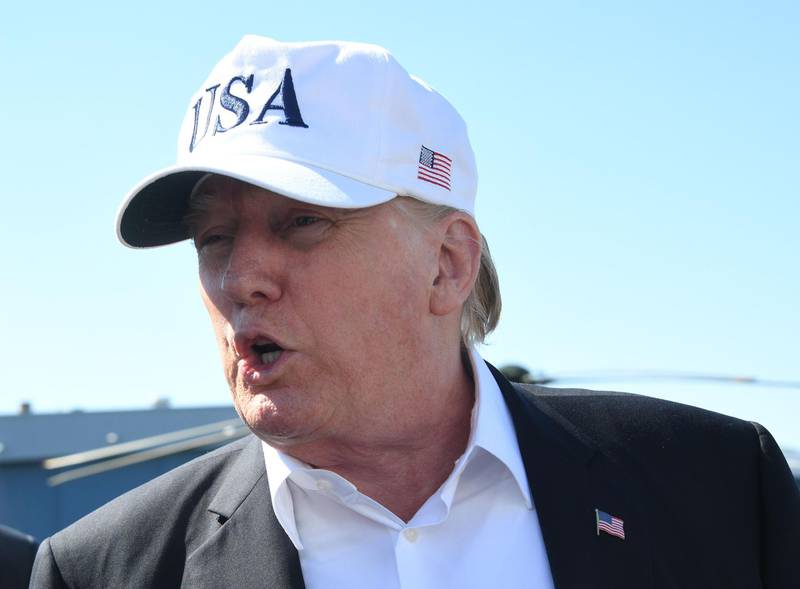 (FILES) In this file photo taken on July 8, 2018 US President Donald Trump confers with the media upon arrival at Morristown Municipal Airport in Morristown, New Jersey, prior to boarding Air Force One following a weekend in Bedminster, New Jersey. US President Donald Trump on July 9, 2018 criticized NATO member states' military spending and said it benefits Europe more than America, setting the stage for a potentially-acrimonious summit with leaders of the alliance."The United States is spending far more on NATO than any other Country. This is not fair, nor is it acceptable," Trump tweeted a day before he departs for the summit, which will take place July 11-12 in Brussels."While these countries have been increasing their contributions since I took office, they must do much more," he wrote, adding that NATO benefits "Europe far more than it does the US. / AFP / JIM WATSON 
