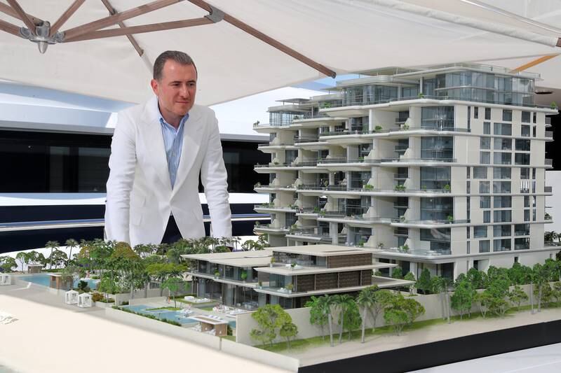 Mahdi Amjad, founder and executive chairman of Omniyat with the model of the ORLA development by Omniyat  in Dubai. Pawan Singh / The National