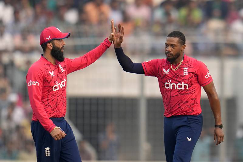 England's Chris Jordan, right, celebrates with teammate Moeen Ali after the dismissal of Bangladesh opener Litton Das. AP