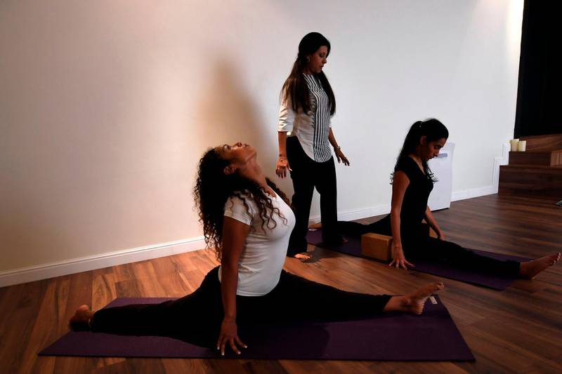 Nouf Marwaai, 38, the head of the Arab Yoga Foundation (C), instructs her yoga students with at her studio in the western Saudi Arabian city of Jeddah on September 7, 2018. Photo / AFP