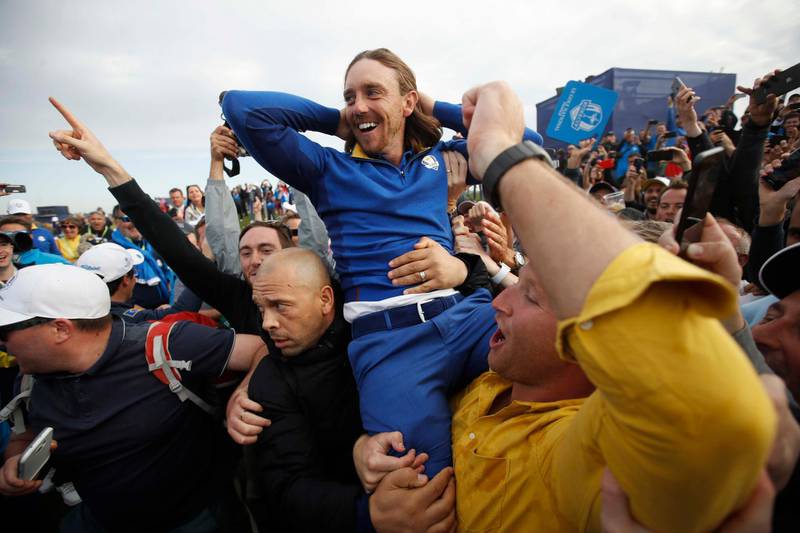 Tommy Fleetwood celebrates with spectators after winning the Ryder Cup. Reuters