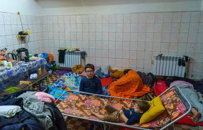 Children shelter in a metro station in Kharkiv. Moscow said on March 10, 2022, that it will open daily humanitarian corridors to allow civilians fleeing fighting in Ukraine to reach Russian territory, despite Kyiv insisting that no evacuation routes should lead to Russia. AFP