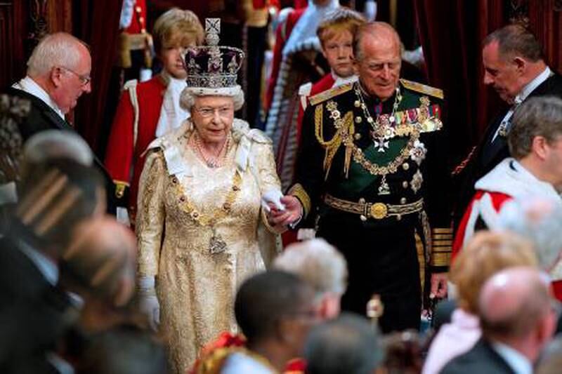 epa02772311 (FILE) A file picture dated 25 May 2010 shows Britain's Queen Elizabeth II (C-L) holding the hand of her husband Prince Philip, Duke of Edinburgh as she arrives to address to the House of Lords, during the State Opening of Parliament in Westminster, central London, Britain. On 10 June 2011 Prince Philip, Duke of Edinburgh will celebrate his 90 birthday.  EPA/STR  UK OUT *** Local Caption *** 02172294 02772311.jpg