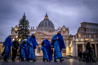Nuns arrive at dawn to view the body of Pope Emeritus Benedict XVI as it lies in state. AP
