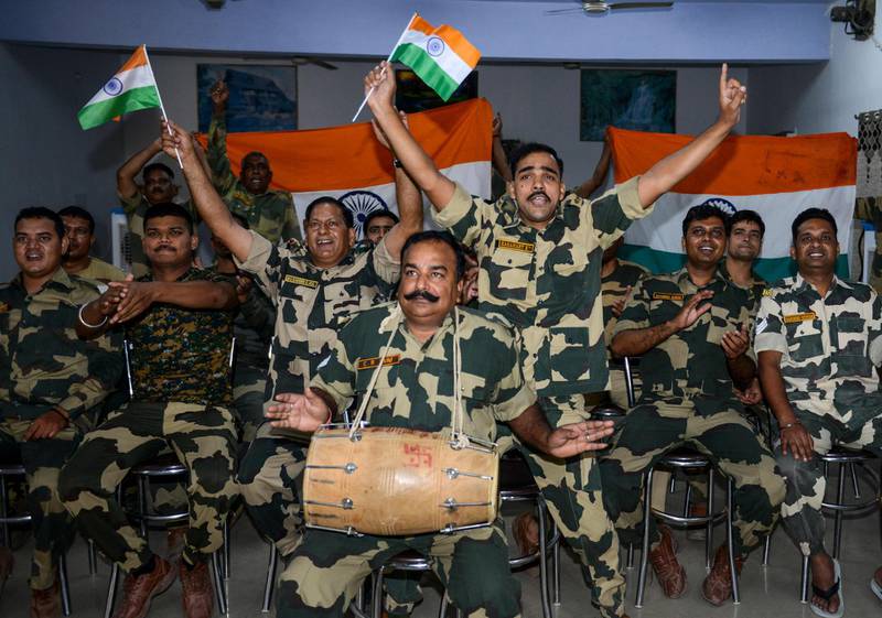 Indian Border Security Force (BSF) personnel celebrate as they watch a live broadcast of the match at the BSF headquarters in Khasa on the outskirts of Amritsar. AFP