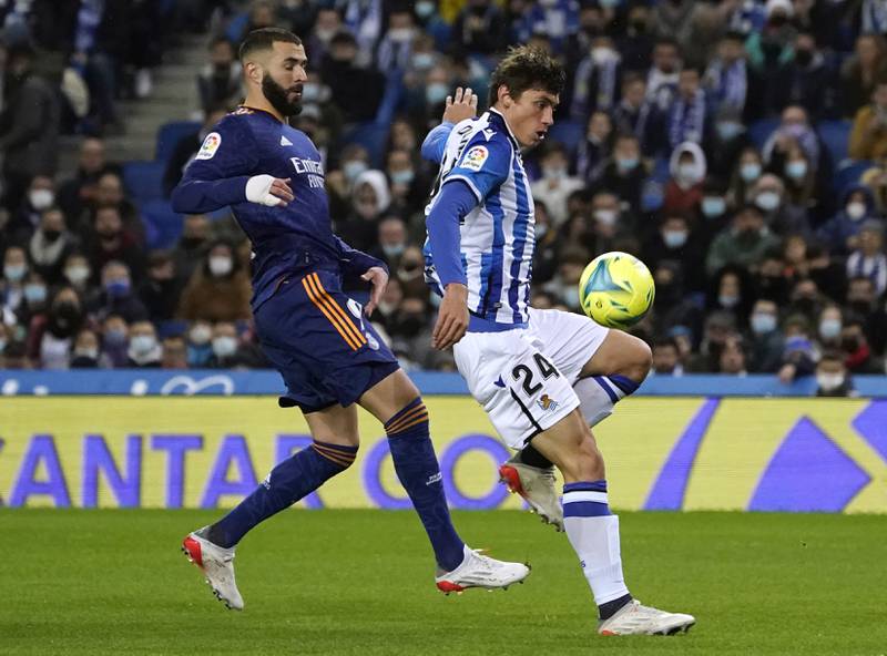 Real Sociedad's Robin Le Normand in action with Real Madrid's Karim Benzema. Reuters
