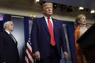 U.S. President Donald Trump, center, and Vice President Mike Pence, left, listen as Deborah Birx, coronavirus response coordinator, right, speaks during a Coronavirus Task Force news conference at the White House in Washington, D.C., U.S., on Friday, April 3, 2020. Trump said the U.S. Centers for Disease and Prevention is recommending the use of non-surgical grade cloth masks as a voluntary measure to prevent the spread of the coronavirus. Photographer: Yuri Gripas/Abaca/Bloomberg