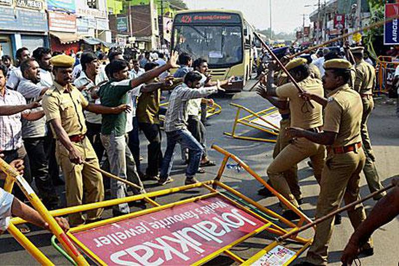Indian Muslim activists protesting against actor Kamal Hassan's controversial spy thriller Vishwaroopam clash with police Madurai, India.