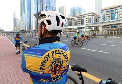 A rider poses for pictures along Sheikh Zayed Road 