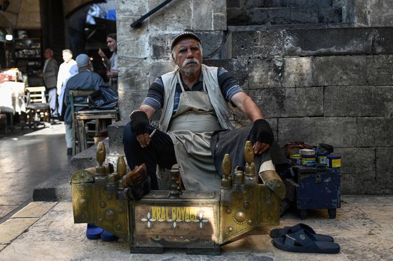 Turks, such as this man running a shoeshine business in Sanliurfa, were third on the list. AFP