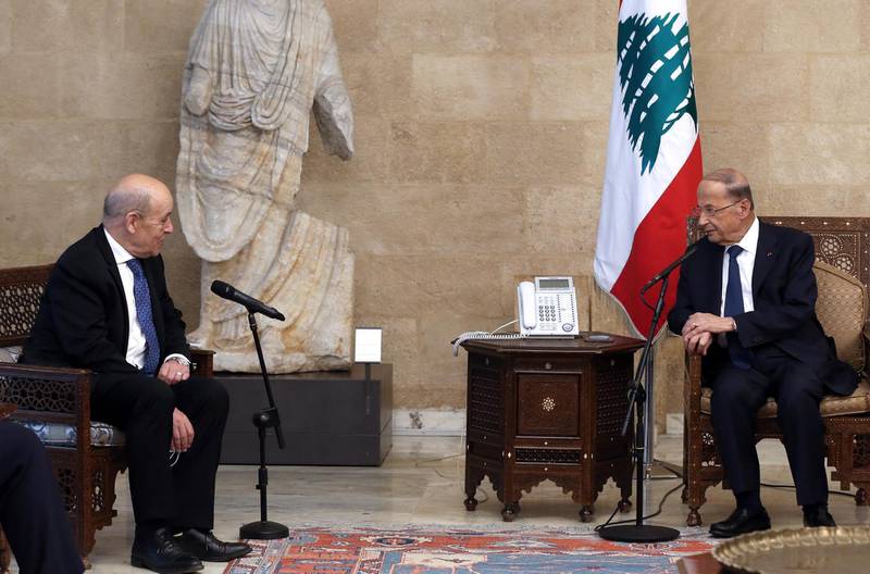 epa09180317 A handout picture made available by Lebanese official photographer Dalati Nohra shows President Michel Aoun (R) meeting with French Minister of Foreign Affairs Jean Yves Le Drian (L) at the Presidential Palace in Baabda east of Beirut, Lebanon 06 May 2021.  EPA/DALATI NOHRA HANDOUT  HANDOUT EDITORIAL USE ONLY/NO SALES