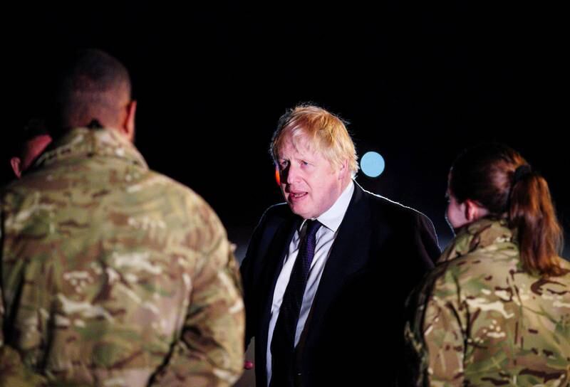 British Prime Minister Boris Johnson meets military personnel at Royal Air Force Brize Norton station to thank them for their support to Ukraine and Nato. Reuters