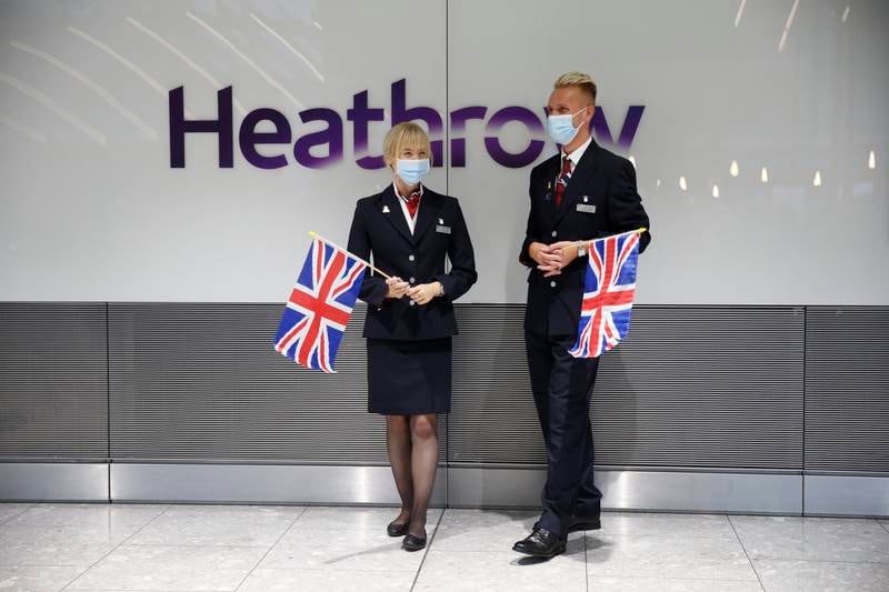 British Airways employees at arrivals in Heathrow Airport. Getty Images