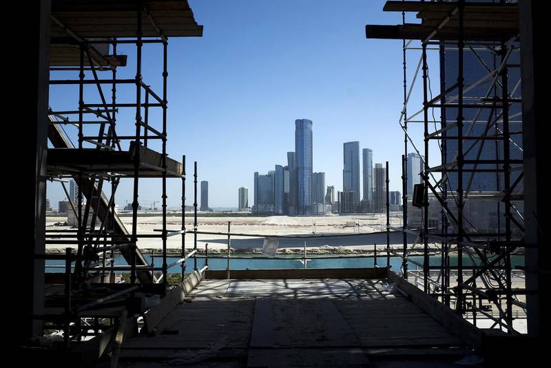 Above, a view of Reem Island from a construction site at Al Maryah Island. Aldar’s planned Shams Marina serviced apartment and apartment scheme was one of a number of projects signed off by the city’s Urban Planning Council. Delores Johnson / The National