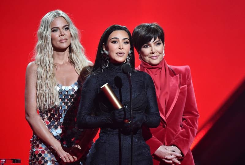 From left, Khloe Kardashian, Kim Kardashian West and their mother Kris Jenner accept the Reality Show of 2021 Award for ‘Keeping Up with the Kardashians' at the 2021 People's Choice Awards held in Santa Monica, California, on December 7, 2021. Getty Images