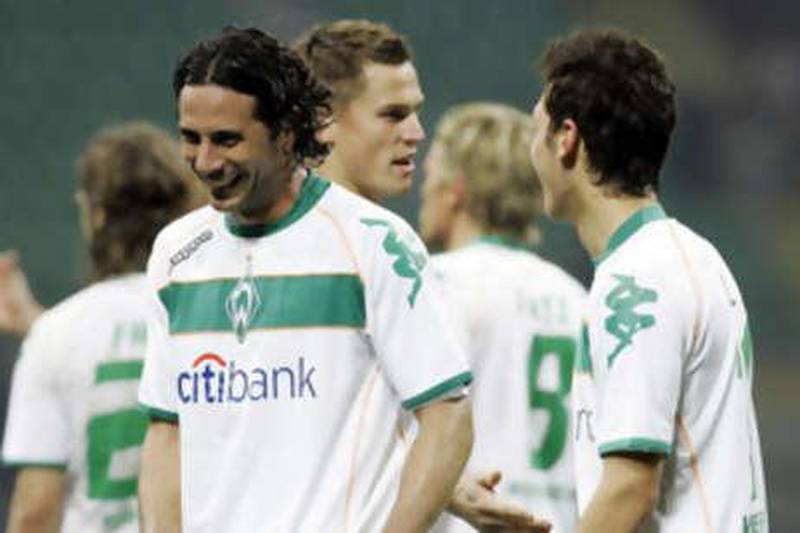 Werder Bremen's Claudio Pizarro, left, celebrates his equaliser against Inter Milan.