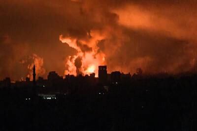 A video grab shows fireballs and smoke rising above Gaza city following an Israeli attack. AFP