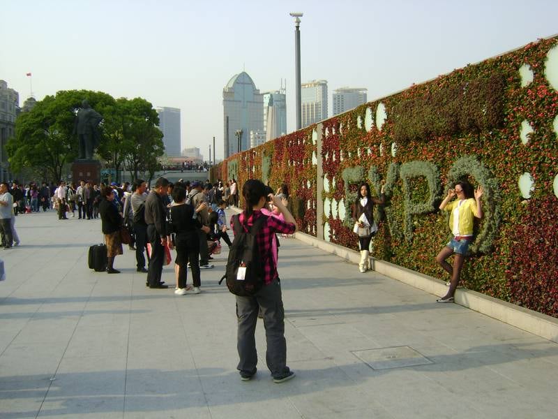 People take photos in central Shanghai ahead of the opening of Expo 2010.