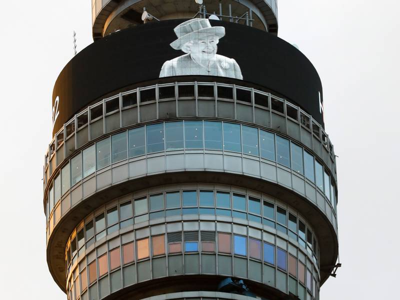 An image of Queen Elizabeth II is displayed on The BT Tower in London. Getty