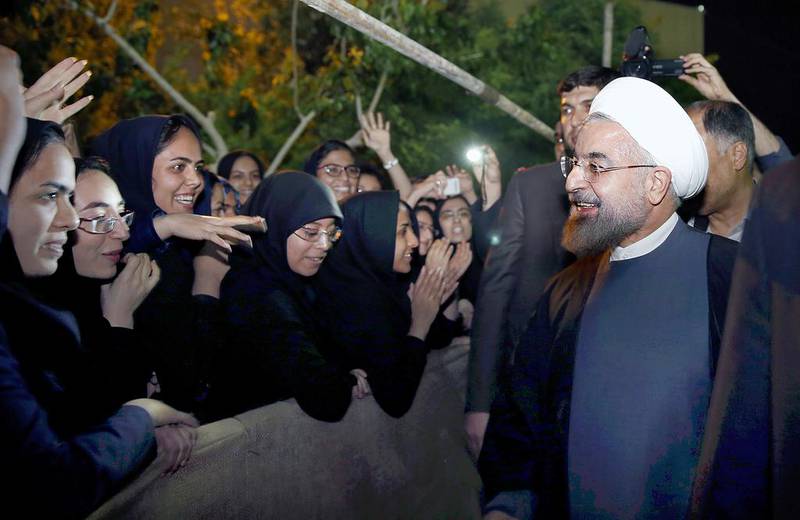 Iranian President Hassan Rouhani greeted by university students as he leaves Sistan University in Sistan and Baluchestan’s provincial capital of Zahedan on Tuesday, April 15, 2014. Maryam Rahmanian for The National