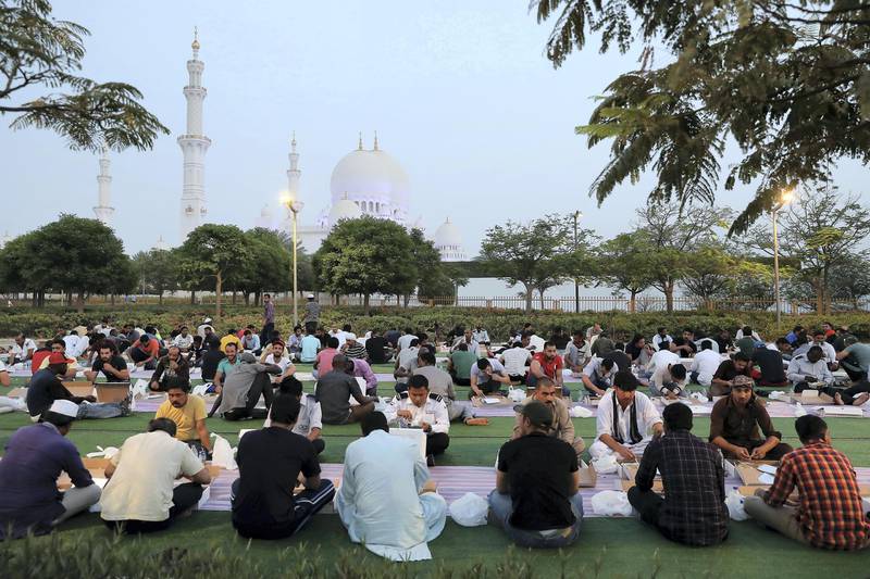 ABU DHABI,  UNITED ARAB EMIRATES , May 6 – 2019 :- People breaking their fast on the First day of Ramadan at the Sheikh Zayed Grand Mosque in Abu Dhabi. ( Pawan Singh / The National ) For News/Online/Big Picture/ Instagram