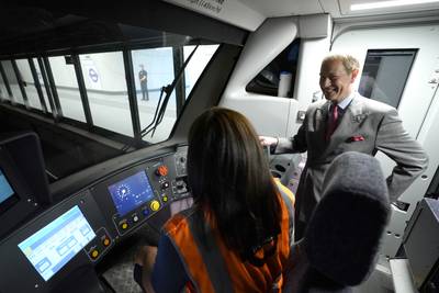 Prince Edward talks to driver Carinne Spinola in the cab of an Elizabeth Line train. PA