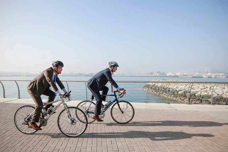 Abu Dhabi, United Arab Emirates. January 8, 2015///

Left to right: Jaap-Jan Boom, 31 and Bram Herfkens, 34 cycle to their work in Sowwah square. Abu Dhabi, United Arab Emirates. Mona Al Marzooqi/ The National 

Reporter: Leanne Graves 
Section: National  *** Local Caption ***  150108-MM-Boom&Herfkens-007.JPG
