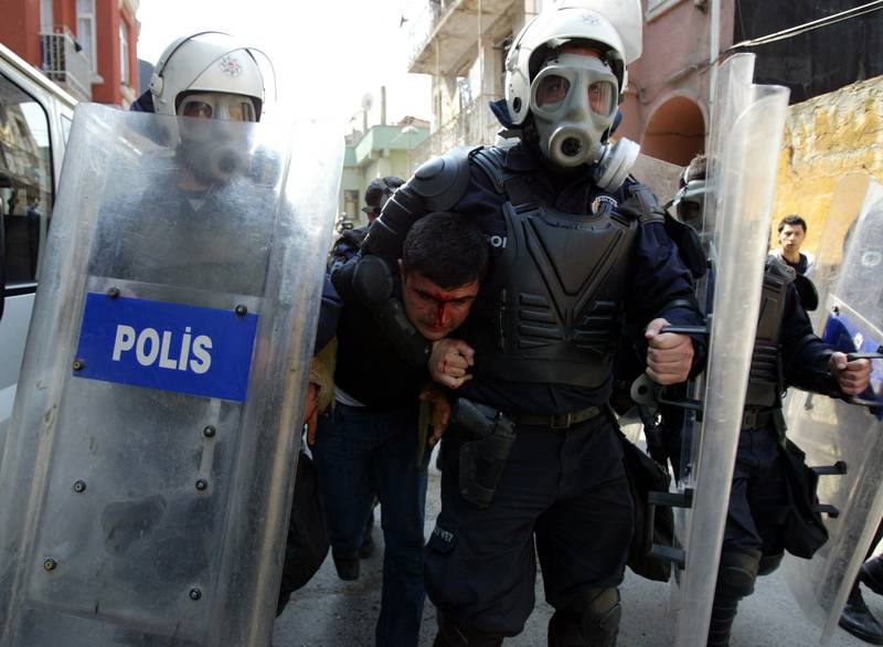 Turkish riot police detain a Kurdish protester following a demonstration in central Istanbul on April 2, 2006. Reuters