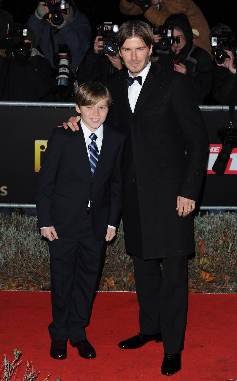 epa02496882 British soccer player David Beckham arrives with son Brooklyn at 'A Night Of Heroes', The Sun Military Awards, held at the Imperial War Museum in South London, Britain, 15 December 2010.
The awards' founding patron HRH The Prince of Wales, Prince Charles and celebrities attend the annual awards honouring British troops. The event is sponsored by The Sun newspaper and the British Ministry of Defence.  EPA/DANIEL DEME
