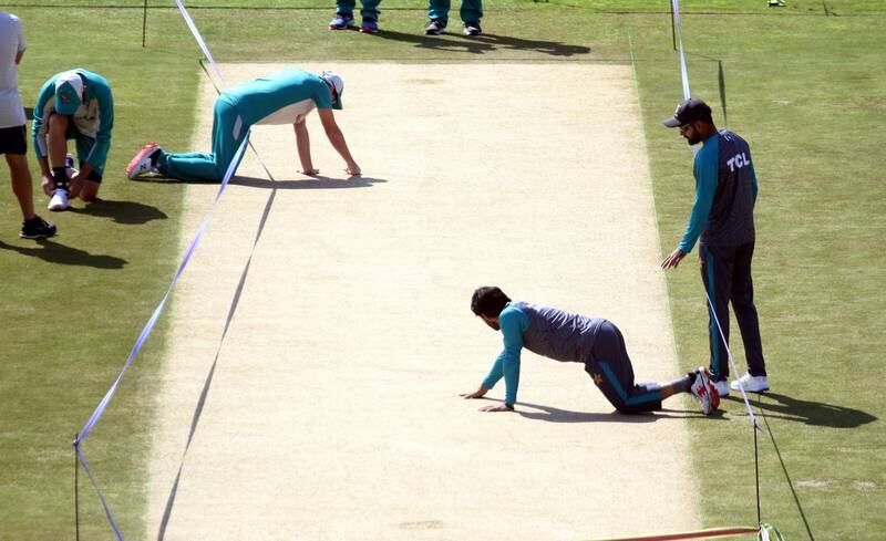 Pakistani and Australian team members inspect the pitch at the Rawalpindi Cricket Stadium. EPA
