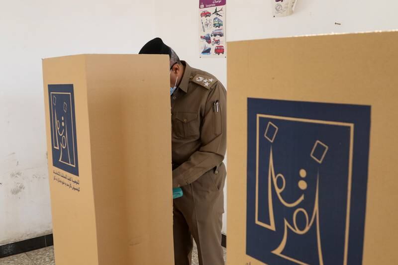 An Iraqi officer at a polling station in the capital, Baghdad. Reuters
