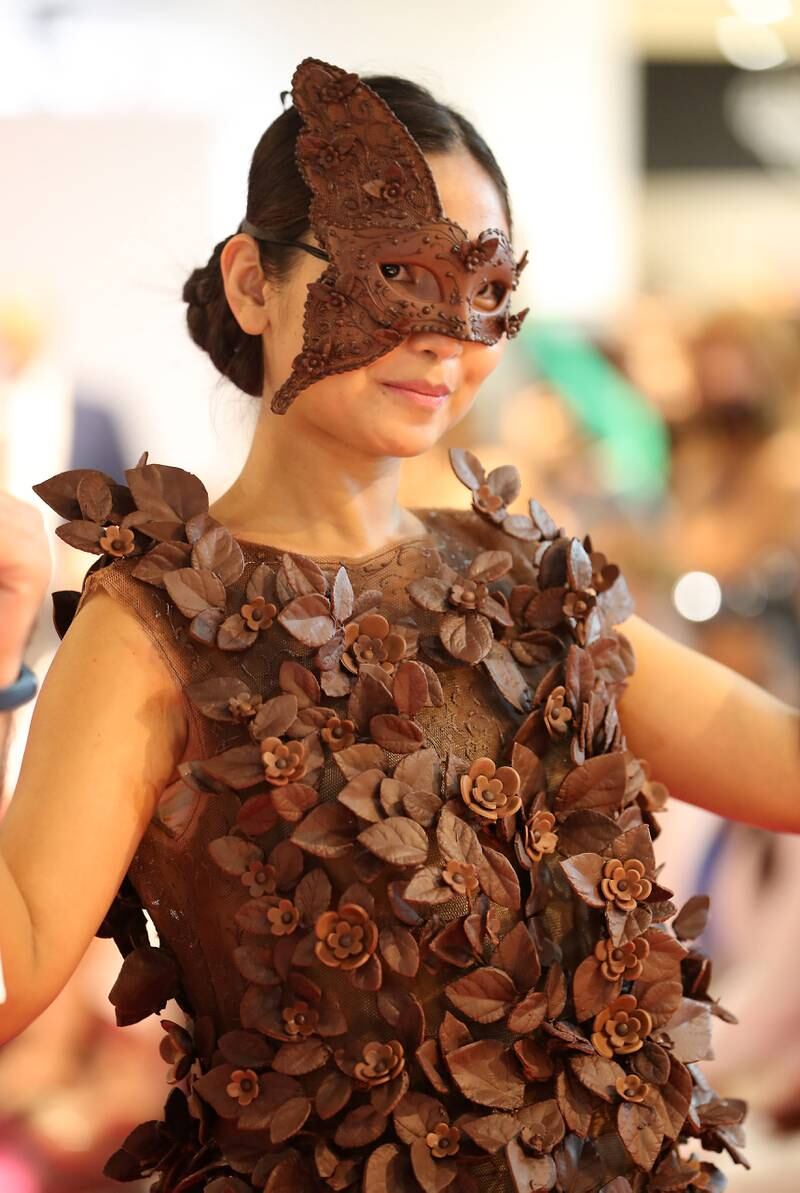 Another model in an all-chocolate outfit including an eye mask.