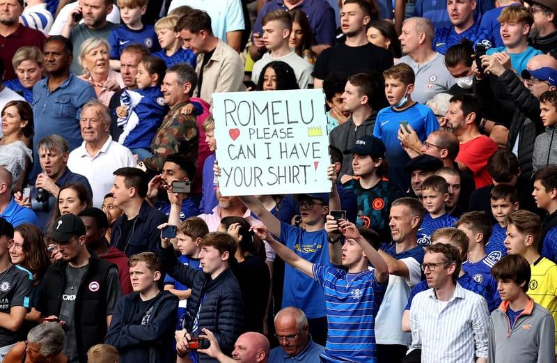 A fan holds up a sign at Stamford Bridge during the game between Chelsea and Aston Villa in September 2021. Getty