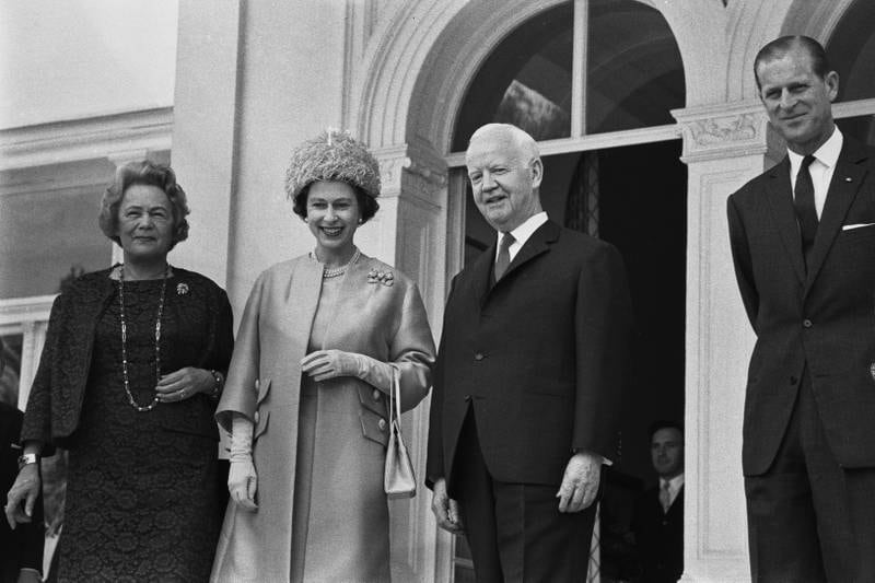 Queen Elizabeth stands next to former president Heinrich Lubke of West Germany in Bonn during a state visit in May 1965. Getty Images