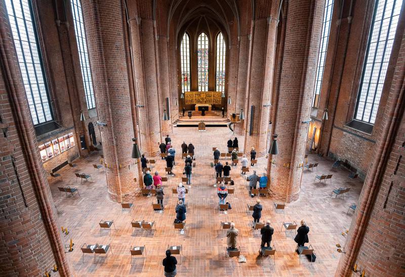 Worshippers celebrate a Good Friday service at the Marktkirche in Hanover, Germany, on April 2, 2021. dpa via AP