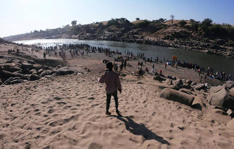 Ethiopians who fled the ongoing fighting in Tigray region are seen at the Setit River on the Sudan-Ethiopia border in Hamdait village in eastern Kassala state, Sudan. Reuters