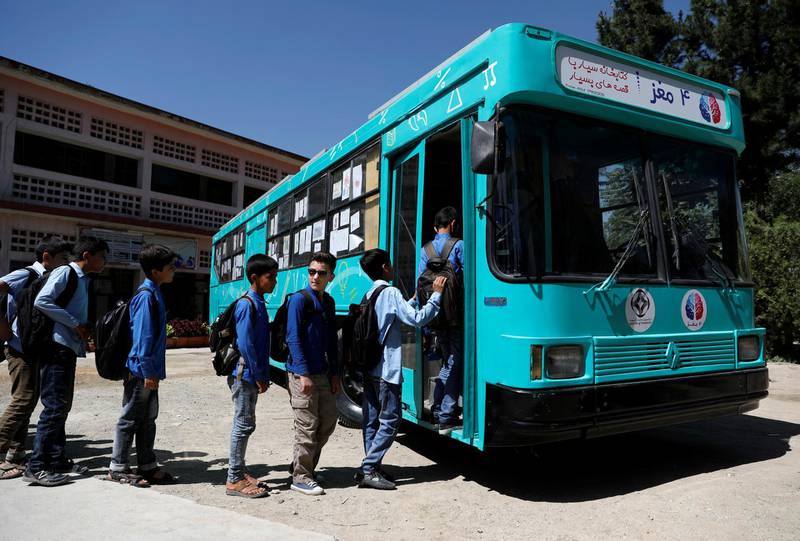 School boys board on a mobile library bus in Kabul, Afghanistan. All photos by Reuters
