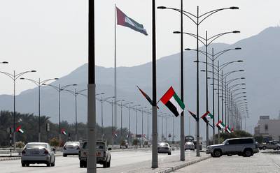 SHARJAH , UNITED ARAB EMIRATES , NOV 2   – 2017 :- Roads in Kalba decorated with UAE flags on the Flag Day celebration in Sharjah. (Pawan Singh / The National) 