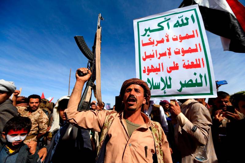 TOPSHOT - Supporters of Yemen's Huthi rebels attend a rally marking the fourth anniversary of the Saudi-led coalition's intervention in Yemen, in the capital Sanaa on March 26, 2019. A Saudi-led military coalition entered Yemen in March 2015 with the goal of restoring its "legitimate" government to power after the Huthis and their allies took over Sanaa. / AFP / MOHAMMED HUWAIS
