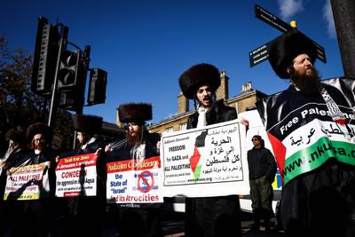 Members of the Ultra-Orthodox Jewish community take part in the 'National March For Palestine' in central London. AFP