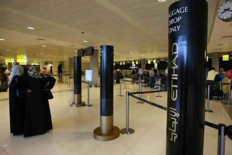 Etihad Airways’ new computer system will enable passengers to complete more of the boarding process before they arrive at the departure gate. Delores Johnson / The National