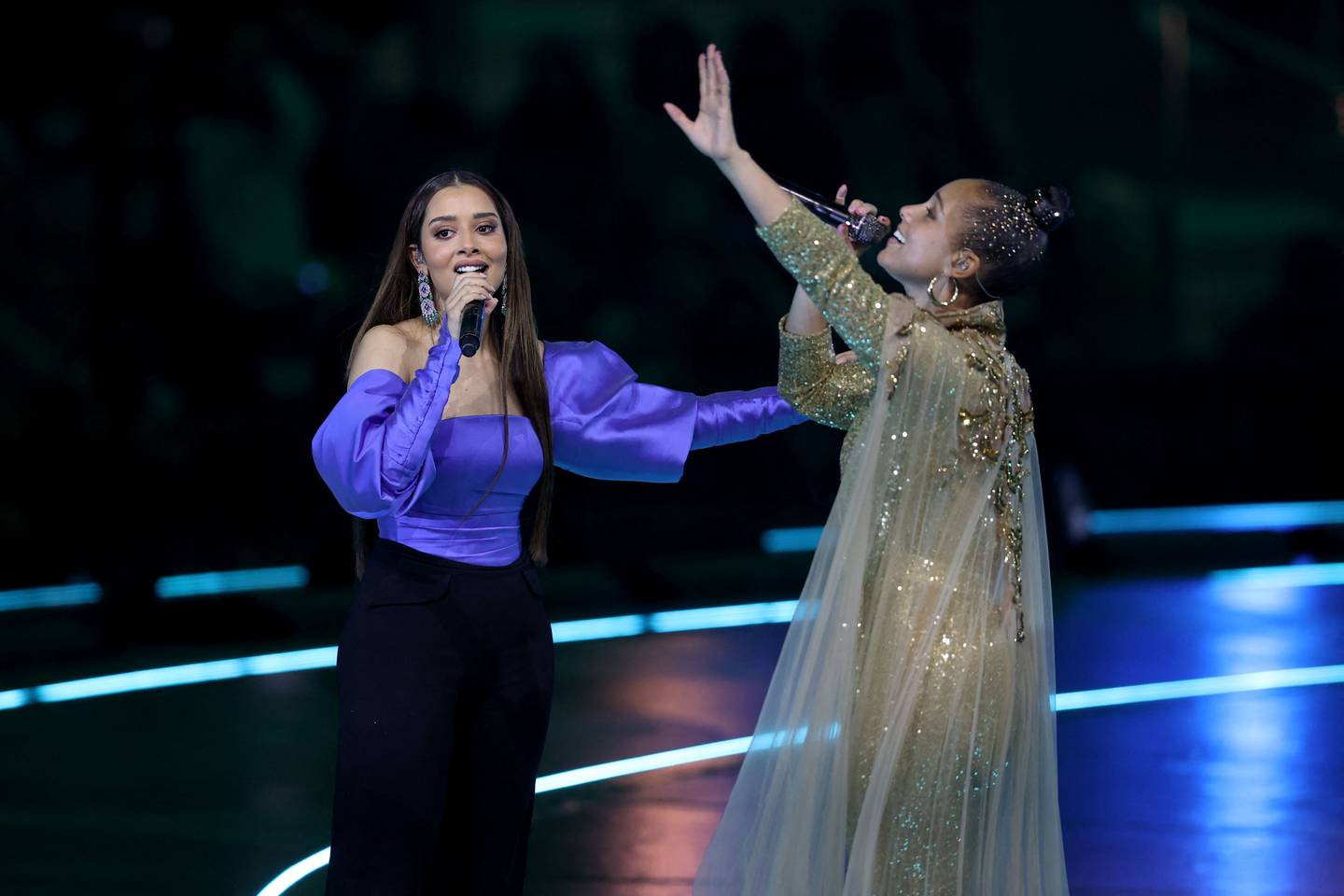 Keys with Emirati singer Balqees Fathi on stage. AFP