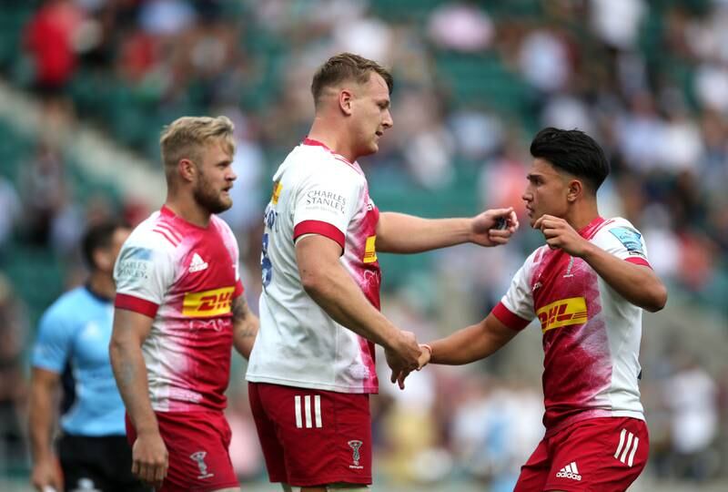 Harlequins' Alex Dombrandt celebrates a try with Marcus Smith.