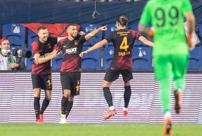 Galatasaray's Younes Belhanda (C) celebrates after scoring the 2-0 lead with team mates Martin Linnes (L) and Taylan Antalyali (R) during the Turkish Super League soccer match between Basaksehir and Galatasaray in Istanbul, Turkey. EPA