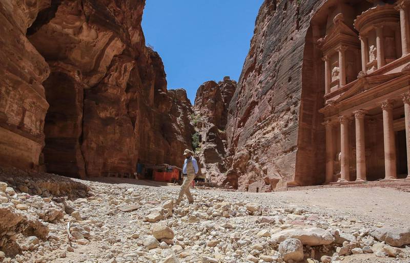 Nayef Hilalat, 42, guards Jordan's ancient city of Petra is pictured empty of tourists on June 1, 2020, amid the COVID-19 pandemic crisis. For over two millennia the ancient city of Petra has towered majestically over the Jordanian desert. Today its famed rose-red temples hewn into the rockface lie empty and silent. / AFP / afp / Khalil MAZRAAWI
