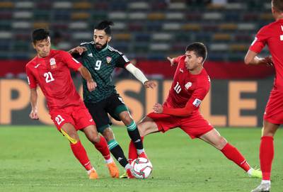 ABU DHABI , UNITED ARAB EMIRATES , January 21 ��� 2019 :- Bandar Mohamed Al Ahbabi ( no 9 in green UAE ) in action during the AFC Asian Cup UAE 2019 football match between UNITED ARAB EMIRATES vs. KYRGYZ REPUBLIC held at Zayed Sports City in Abu Dhabi. ( Pawan Singh / The National ) For News/Sports