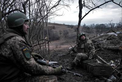 Ukrainian volunteer soldiers hold their positions at the front line near Bakhmut. AFP
